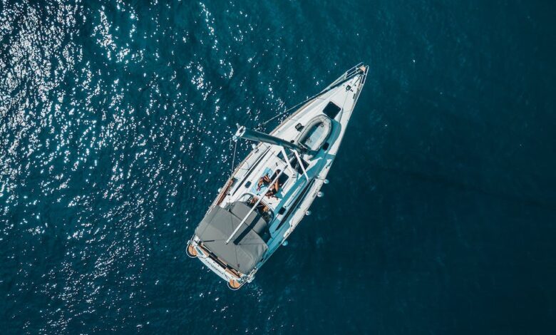 high angle photo of white boat on body of water