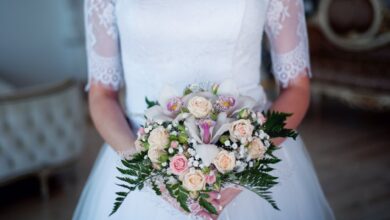 woman wearing wedding gown holding bouquet
